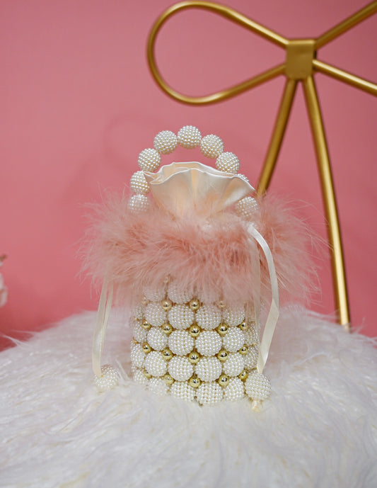 Pearl bag with pink feather